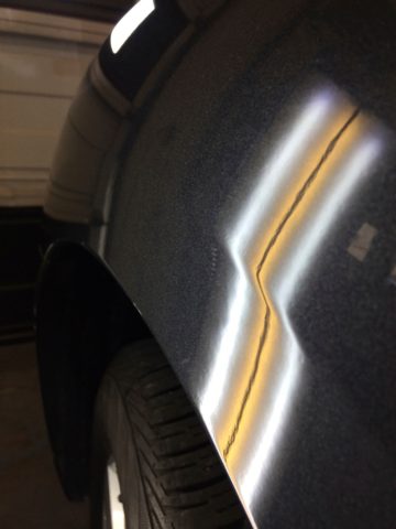 charcoal panel dent removed