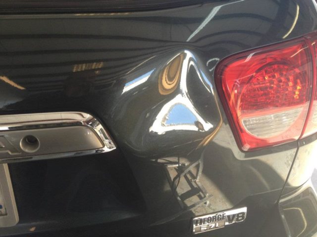 Dent in rear door of Toyota Sequoia
